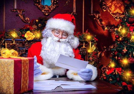 Santa reading a letter.