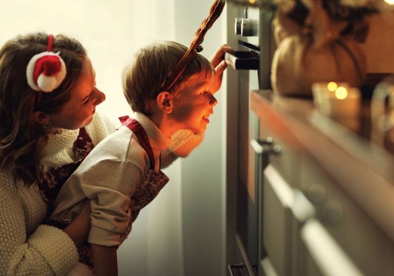 Mother and son cooking a festive meal.