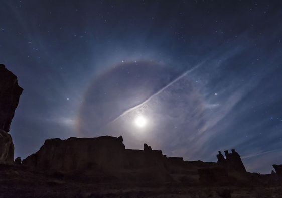 A moon halo over Arches National Park.