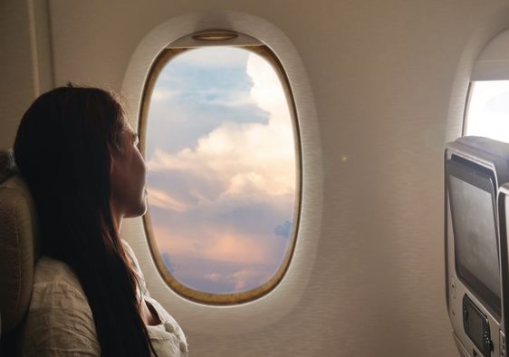 Calm woman on an airplane.