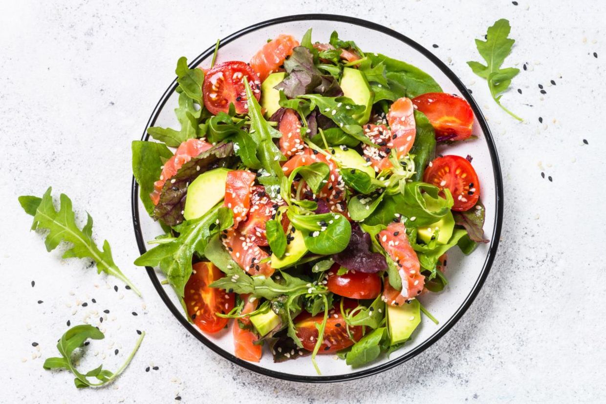 Salmon, avocado, and tomato salad is good for your health.