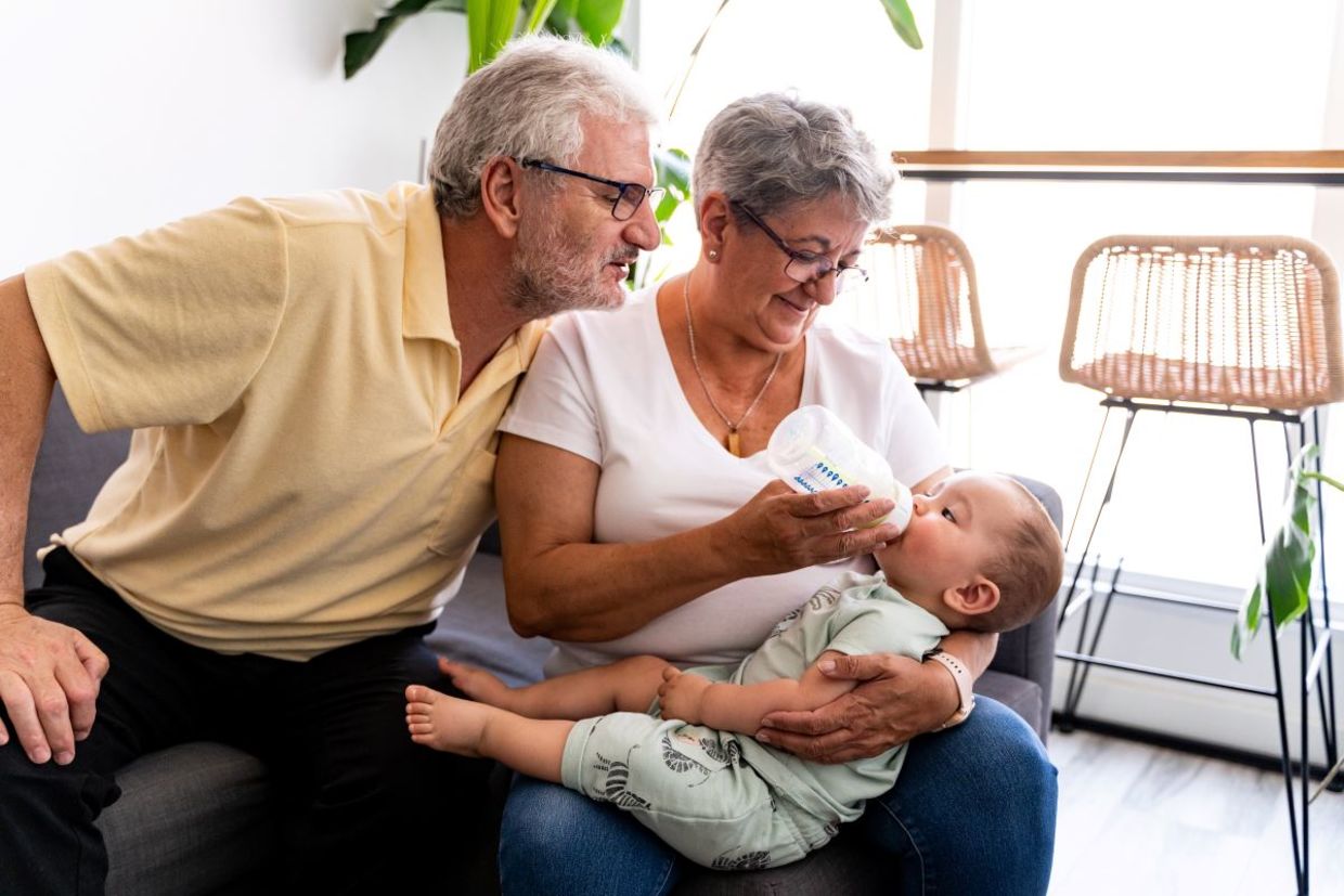 Grandparents babysitting their granschild.