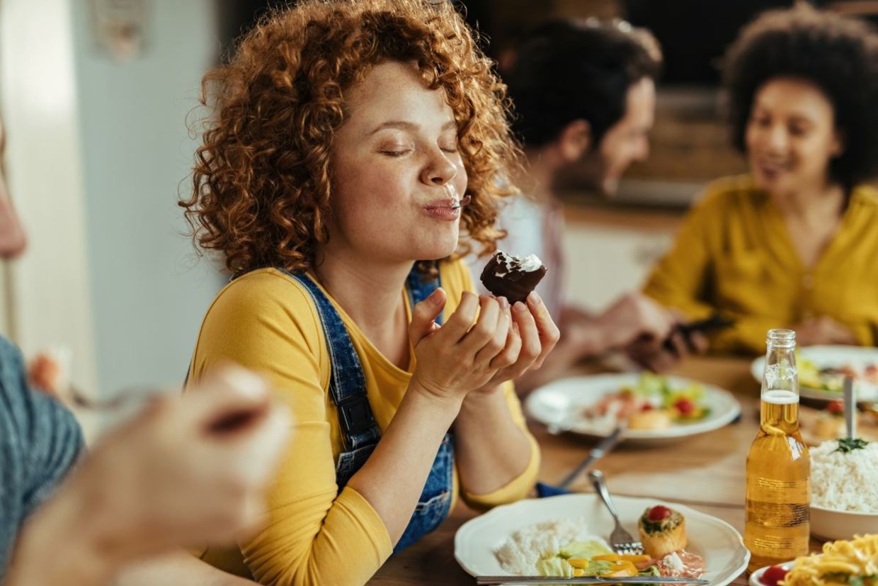 Woman enjoying her meal.