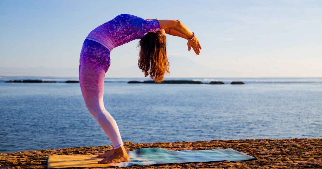 entering the raised arms yoga pose.