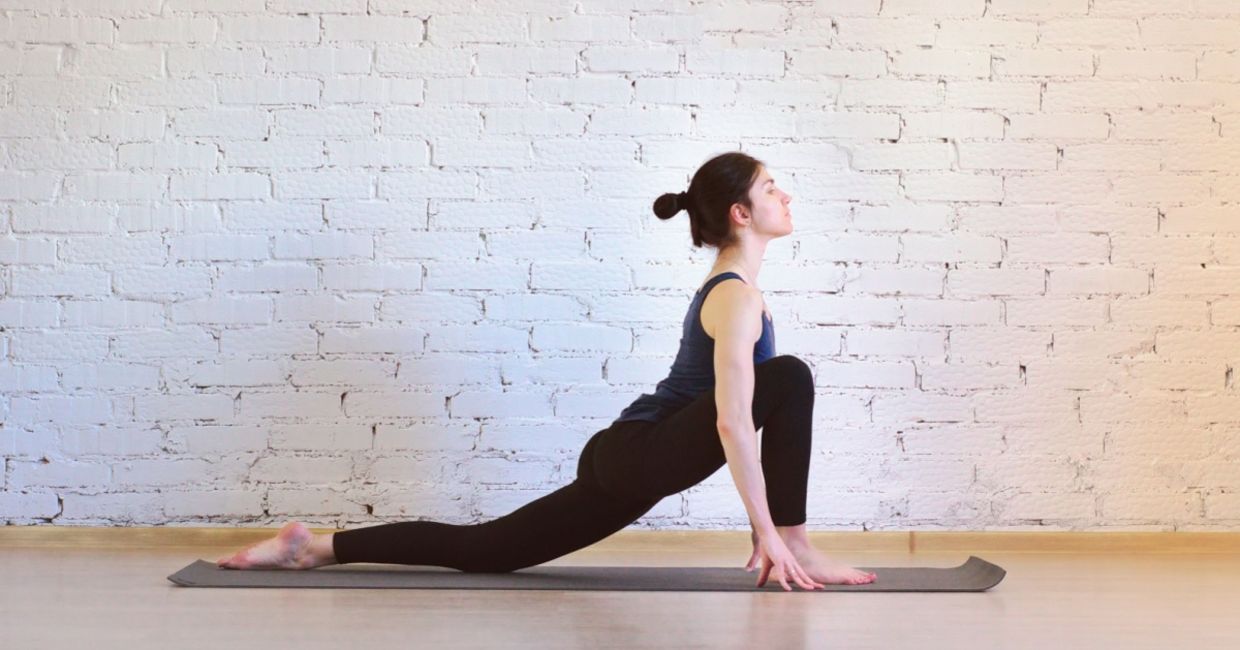 Woman in the equestrian yoga pose.