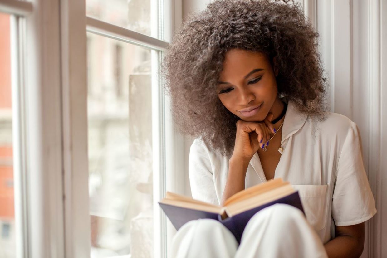 a woman engrossed in a good book.