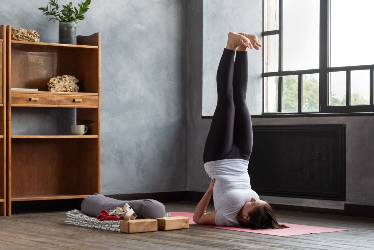 Relieve tension in the legs up the wall yoga pose.