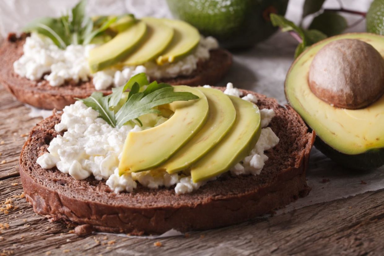 Cottage cheese and avocado open sandwich.