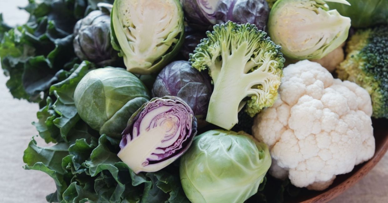 Fresh cauliflower, broccoli, and Brussels sprouts.