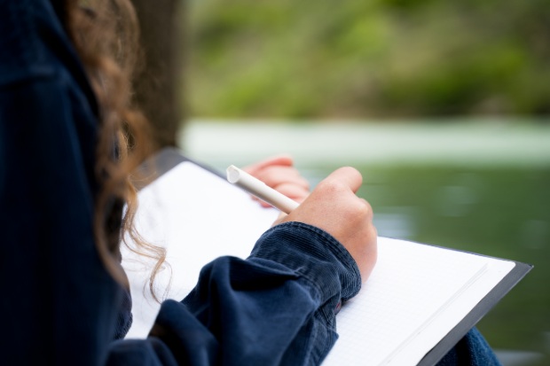 Woman writing a journal